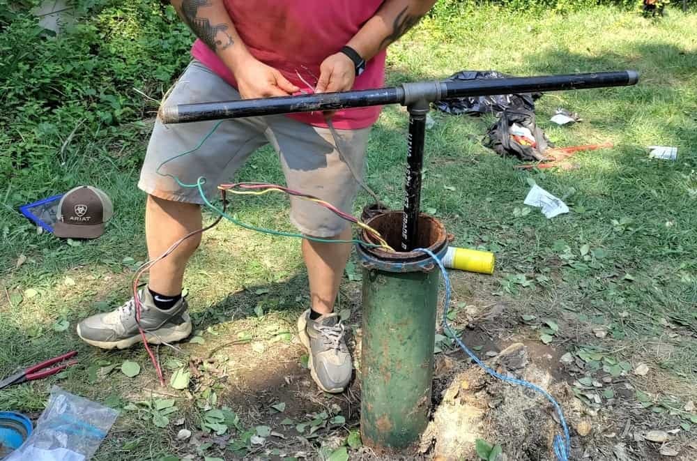 Residential well pump system components during a repair inspection